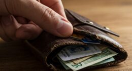 A wallet full of credit cards and cash