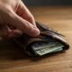 A wallet full of credit cards and cash