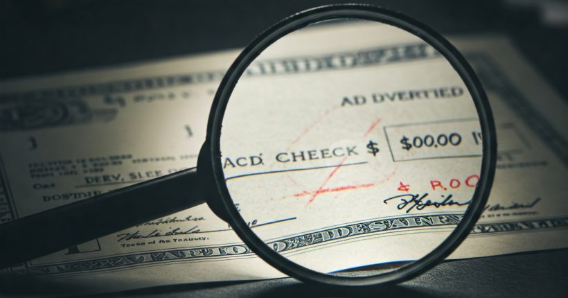 Image illustrating altered check fraud, showing a check with changes to the payee and amount.